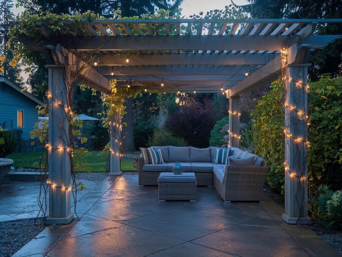 Stamped concrete patio with pergola and outdoor furniture